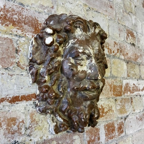 211 - A wall mounted Green Man type mask 31cm high