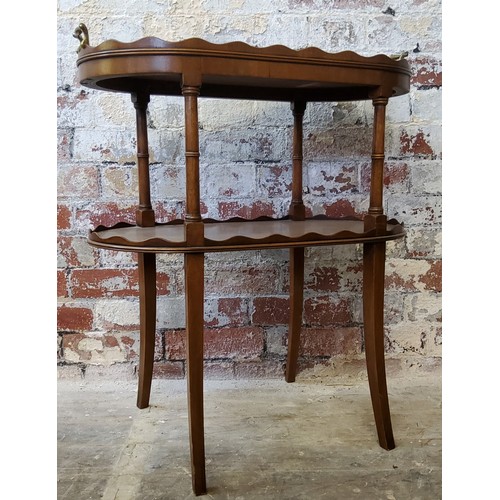 220 - A good reproduction fiddle back mahogany split veneer twin brass handled two tier occasional table/s... 