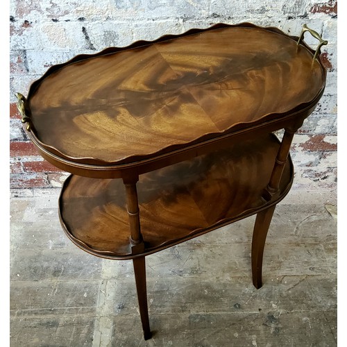 220 - A good reproduction fiddle back mahogany split veneer twin brass handled two tier occasional table/s... 