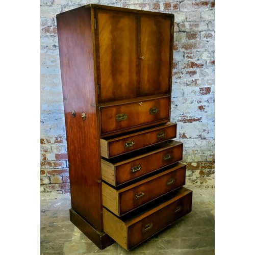 233 - A good mid 20th century brass mounted teak campaign style drinks cabinet, the cupboard doors enclosi... 