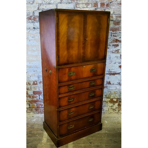 233 - A good mid 20th century brass mounted teak campaign style drinks cabinet, the cupboard doors enclosi... 