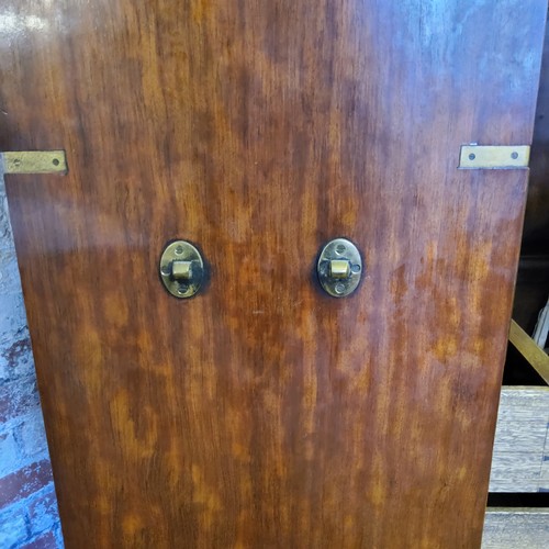 233 - A good mid 20th century brass mounted teak campaign style drinks cabinet, the cupboard doors enclosi... 