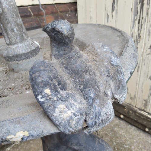 239 - Garden Statutory & Salvage - An early 19th century lead bird bath, the shallow dish surmounted w... 