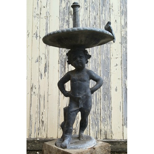 239 - Garden Statutory & Salvage - An early 19th century lead bird bath, the shallow dish surmounted w... 