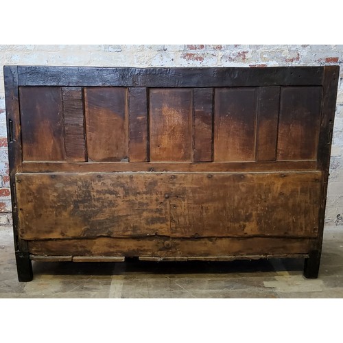 242 - A 17th century carved oak five panel backed box seat settle, with iron bound hinged seat and open sc... 