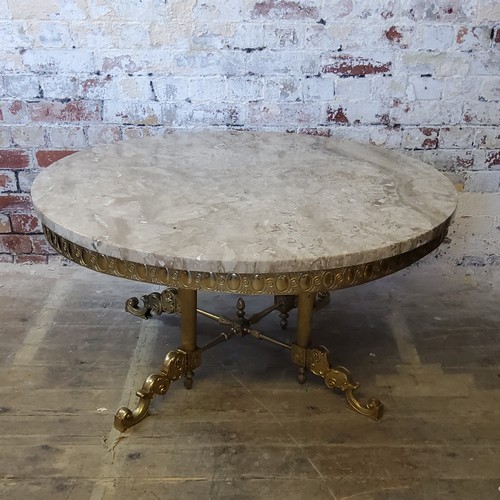 244 - A large Empire taste veined marble topped coffee table, raised on a gilt metal base with four fluted... 