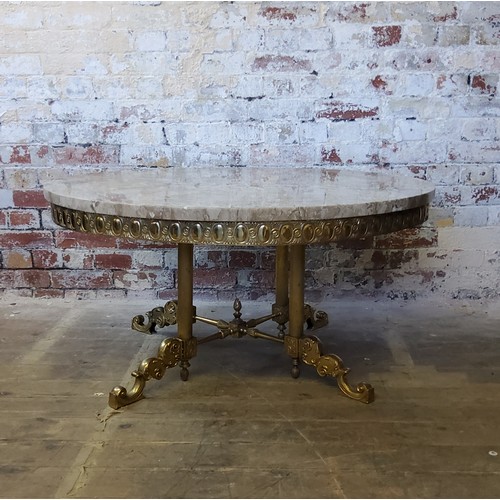 244 - A large Empire taste veined marble topped coffee table, raised on a gilt metal base with four fluted... 