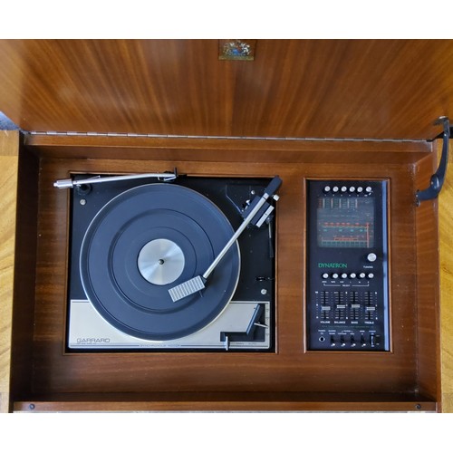 255 - A Mid 20th century vintage Garrard SP 25 vinyl record player in flamed mahogany Dynatron stereogram ... 