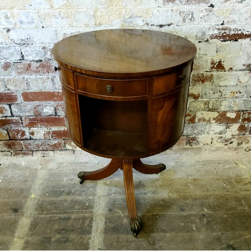 258 - An impressive Regency style mahogany drum library table, the circular flamed mahoagany and cross ban... 