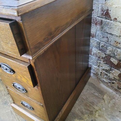 266 - An early 20th century oak knee hole pedestal desk, tooled leather inset surface above one long drawe... 