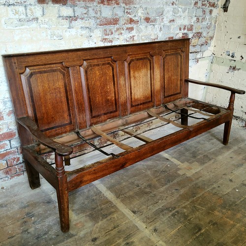 57 - An 18th century country house oak settle, four section walnut inlaid panelled back support, period i... 
