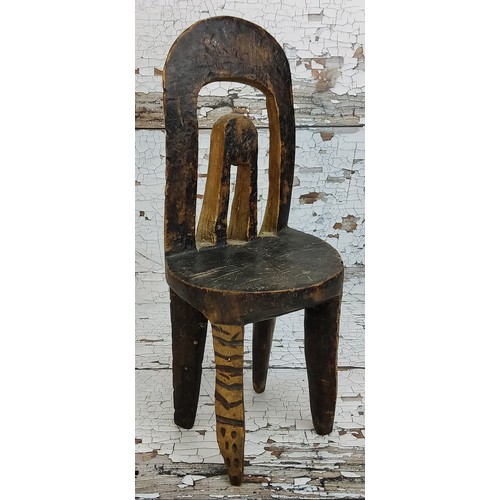 97 - Tribal Art - Ethiopia - a Sidama tribe elder carving of a chair, 30cm high