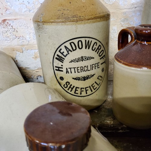 143 - Stoneware - A collection of various stoneware flagons including a Meadowcroft, Attercliffe SHEFFIELD... 