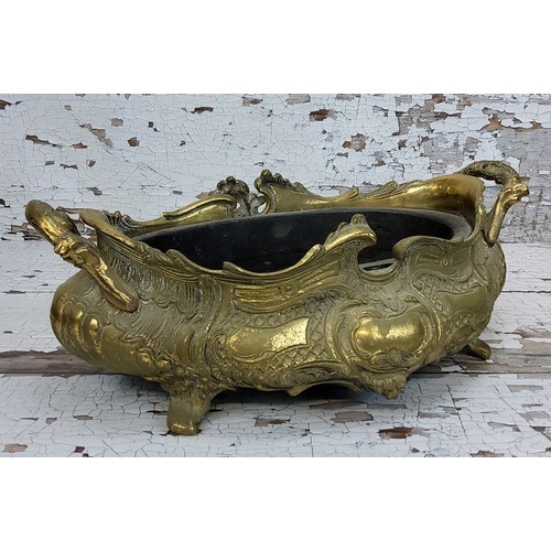 199 - A large Continental brass centrepiece decorated in relief, 41cm wide