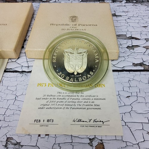 205 - Numismatics - Two 1973 frosted proof Panama 20 Balboas coins, in presentation cases with certificate... 