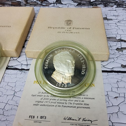205 - Numismatics - Two 1973 frosted proof Panama 20 Balboas coins, in presentation cases with certificate... 