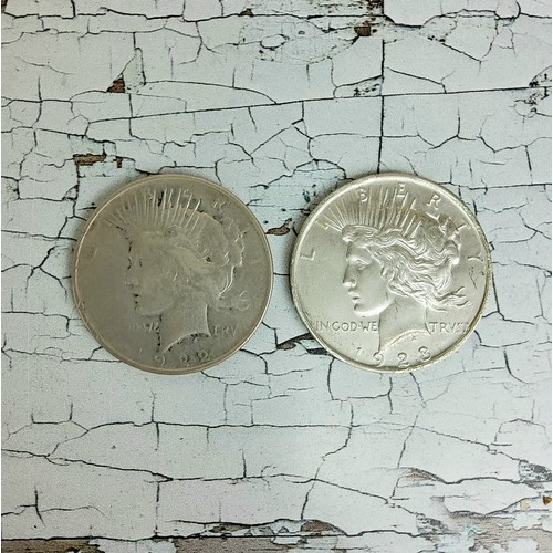 218 - Numismatics - two American liberty peace dollars, both baring Philadelphia mint mark, dated 1922 and... 