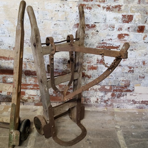 332 - Two sack trucks and metal saddle rack (3)