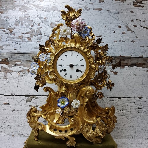 2 - A Napoleon III rocaille gilt metal and porcelain mantel clock, ornate cartouche form applied with en... 