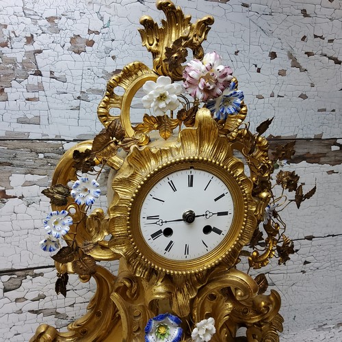 2 - A Napoleon III rocaille gilt metal and porcelain mantel clock, ornate cartouche form applied with en... 