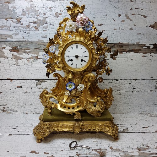 2 - A Napoleon III rocaille gilt metal and porcelain mantel clock, ornate cartouche form applied with en... 