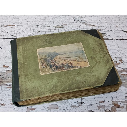 15 - An early 20th century postcard album including embroidered examples