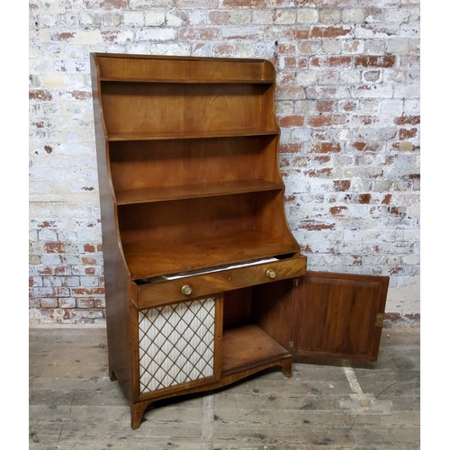 159 - A Regency mahogany freestanding waterfall bookcase, the three ebony strung graduating shelves above ... 