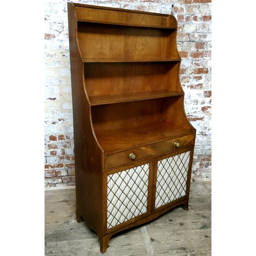 159 - A Regency mahogany freestanding waterfall bookcase, the three ebony strung graduating shelves above ... 