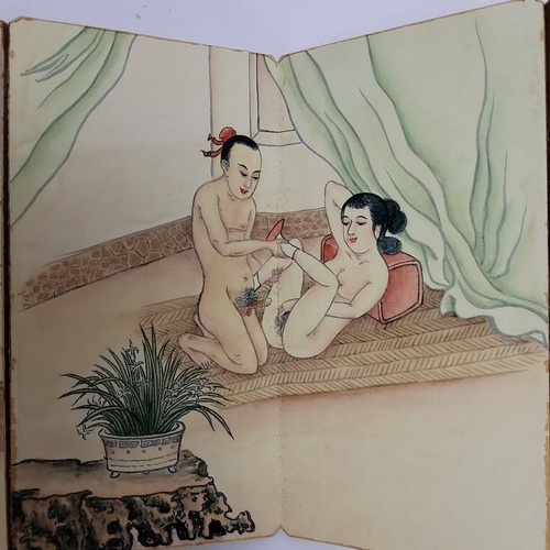 64 - Erotica - an unusual Japanese concertina erotic pillow book, the ten fold out board leaves decorated... 