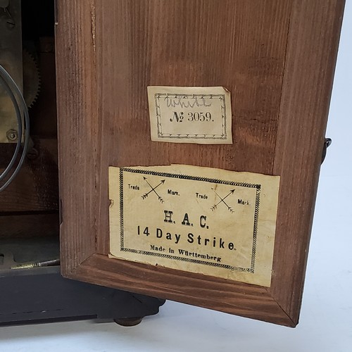 73 - A walnut cased H.A.C. 14 day strike mantel clock, striking on a coiled gong. bevelled glass fronted ... 