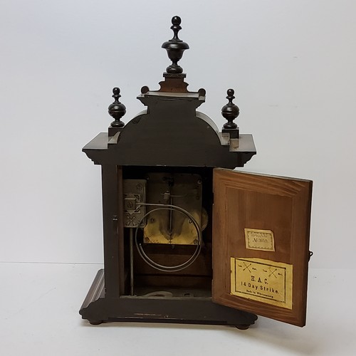 73 - A walnut cased H.A.C. 14 day strike mantel clock, striking on a coiled gong. bevelled glass fronted ... 