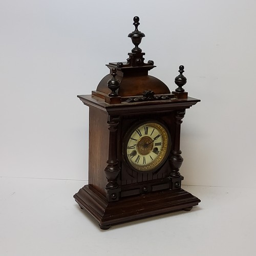 73 - A walnut cased H.A.C. 14 day strike mantel clock, striking on a coiled gong. bevelled glass fronted ... 