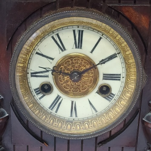 73 - A walnut cased H.A.C. 14 day strike mantel clock, striking on a coiled gong. bevelled glass fronted ... 