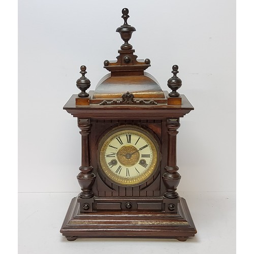 73 - A walnut cased H.A.C. 14 day strike mantel clock, striking on a coiled gong. bevelled glass fronted ... 