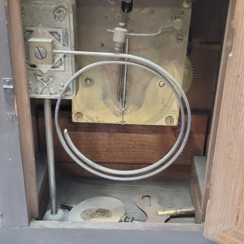 73 - A walnut cased H.A.C. 14 day strike mantel clock, striking on a coiled gong. bevelled glass fronted ... 