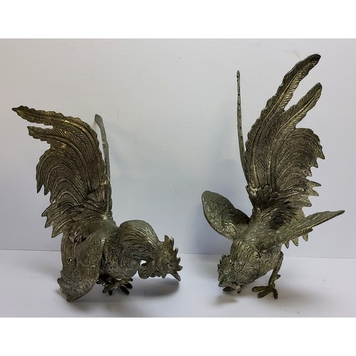 79 - A pair of early 20th century pewter cock fighting models, 15cm high