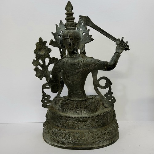 85 - A monumental bronze of Green Tara, Tibet, in 17th century style, seated cross-legged on a lotus thro... 