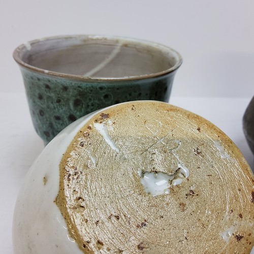 86 - Three pieces of studio pottery including a coiled and raku fired rust glazed example, another smalle... 