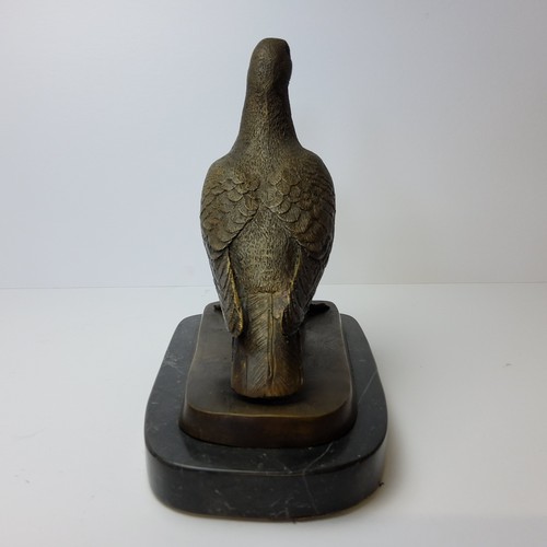 90 - Pigeon Racing Interest - a prize winning pigeon, mounted on a stepped bronze and marble base 24cm hi... 