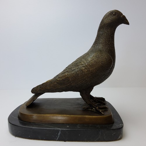 90 - Pigeon Racing Interest - a prize winning pigeon, mounted on a stepped bronze and marble base 24cm hi... 