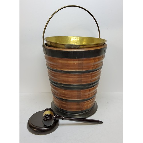 101 - A Dutch walnut and ebonised kettle bucket, decorated with turned banded construction, with a brass l... 