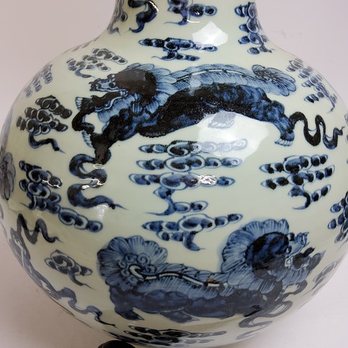 106 - A very large and impressive Chinese temple vase decorated with an all-over, underglaze blue and whit... 