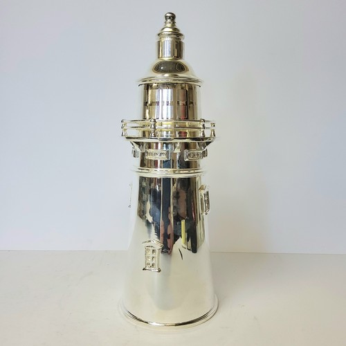 136 - A substantial novelty cocktail shaker in the form a lighthouse, silver plate, 36cm high