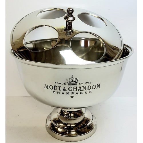 139 - A large Moet Chandon centre piece ice bucket and champagne holder, the lift off cover with four bott... 