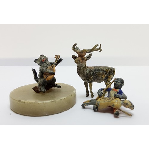 174 - Two cold painted bronze miniatures, including a cat and the fiddle model on an alabaster plinth and ... 