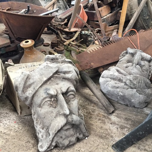 97 - Garden Statuary - a near pair of reconstituted stone Arabian elder masks 30cm high