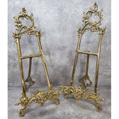 48 - A pair of substantial ornate gilt metal table easels / stands 52cm high