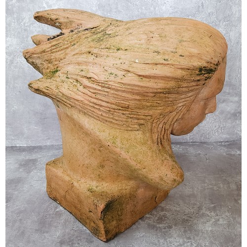 80 - Garden Statutory- a 20th century terracotta sculpture of a woman with wind flowing through her hair,... 