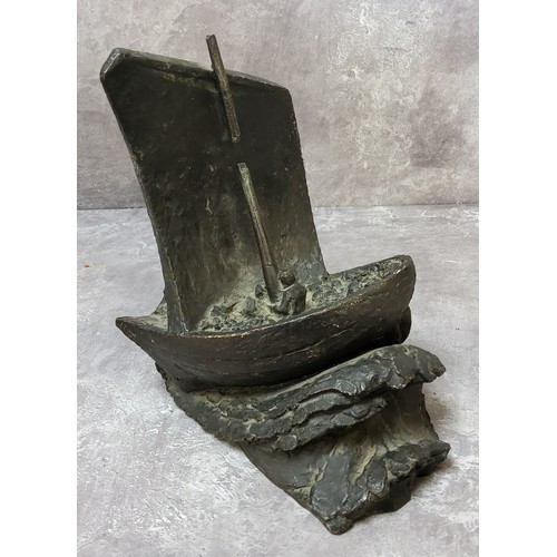 109 - A bronze bookend in the form of a sailing vessel in trouble on a stormy sea, signed E.M.White with a... 