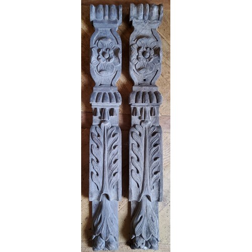 26 - A pair of early 19th century carved oak mantel legs, decorated with a Tudor Rose, stylised oak leave... 